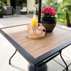 PHI VILLA 5-Piece Patio Dining Set With Wood-look Table & 4 Padded Textilene Swivel Chairs -Phi Villa 4 df334fae bf63 4f9f bb76 f7fe7d40cf4e